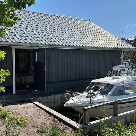 Chalet Majas Backe On A Island With Boat